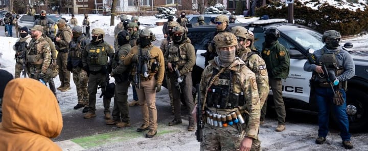 a squad of ICE agents in camoflague and masks